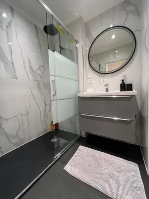 a bathroom with a sink and a mirror at Cosy 2 bedrooms apartment Croisette in Cannes