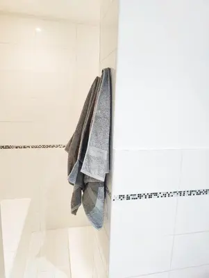 a bathroom with a towel hanging on a shower stall at Garden Flat in Cannes in Cannes