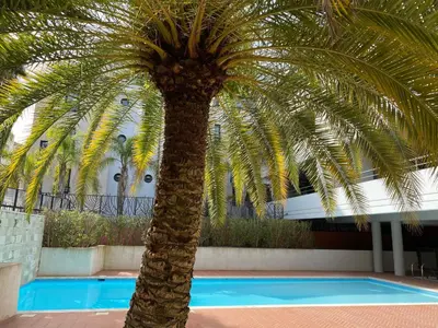a building seen from the balcony of a house at 2 pièces terrasse piscine Cannes Californie in Cannes