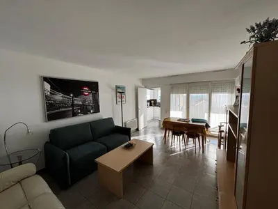 a living room with a couch and a table at Appartamento in riva al mare a Cannes in Cannes