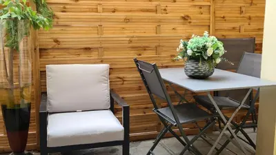 a bathroom with a shower and a toilet and a chair at Maison de ville à Cannes à 450 mètres de la Croisette in Cannes
