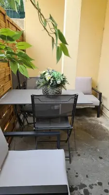 a table with a potted plant on top of it at Maison de ville à Cannes à 450 mètres de la Croisette in Cannes