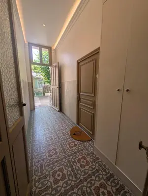 a hallway of a house with a door and a floor at Cannes centre - Enjoy Suite in Cannes