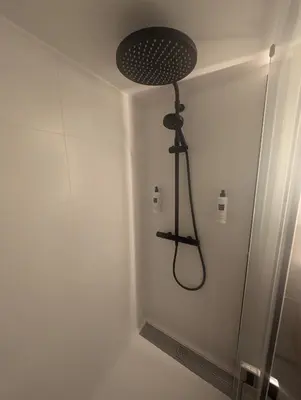 a shower in a bathroom with a shower head at Cannes centre - Enjoy Suite in Cannes