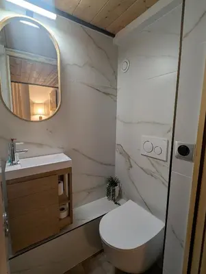 a bathroom with a toilet and a sink and a mirror at Cannes centre - Enjoy Suite in Cannes