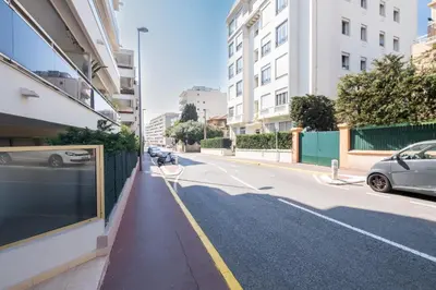 a street with a car parked on the side of a building at Stylish 2-Br Apartment Steps from the Croisette in Cannes