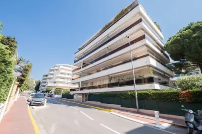 a building on the side of a street at Stylish 2-Br Apartment Steps from the Croisette in Cannes