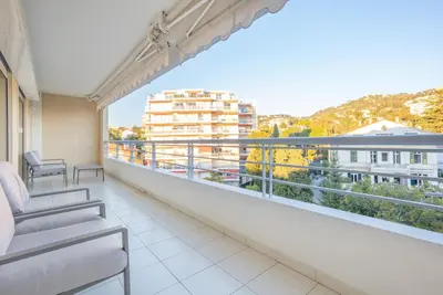 a balcony with a view of a building at Le Parisien by Winsome Destination in Cannes