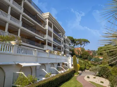 an exterior view of a building with a pathway at The Sun Paradise Dream in Cannes