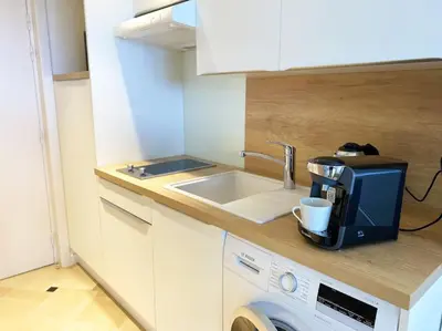 a kitchen with a sink and a coffee maker at The Sun Paradise Dream in Cannes