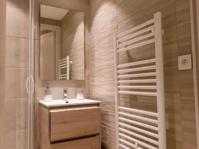 a bathroom with a sink and a mirror at The Sun Paradise Dream in Cannes