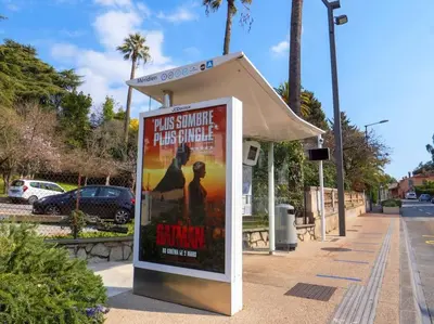 a bus shelter with a poster for a movie at The Sun Paradise Dream in Cannes