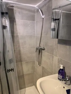 a bathroom with a shower and a sink at Mansarde Cannes in Cannes