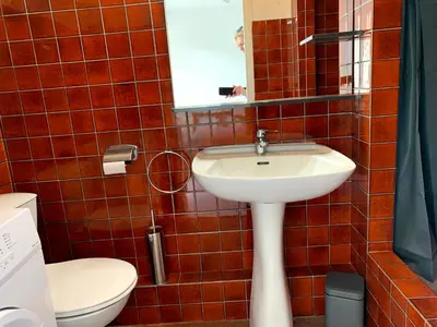 a bathroom with a sink and a toilet at Cannes center parking very calm California neighborhood in Cannes