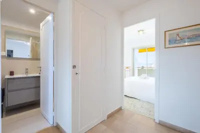 a kitchen and bedroom with a bed and a sink at 3-Br apartment near downtown Cannes Sea view parking in Cannes