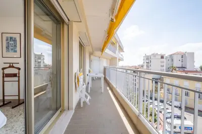a balcony with a view of a city at 3-Br apartment near downtown Cannes Sea view parking in Cannes