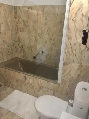 a bathroom with a toilet and a bath tub at jardins croisette PRES CROISETTE in Cannes
