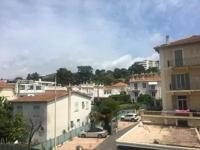 a view of a city with buildings and cars at Cannes center terrace AC Wifi 200 m from sea behind Martinez in Cannes