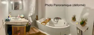 a bathroom with a white tub and a sink at Luxurious Studio in Cannes 450m from sea with Terrace and Air Conditioning and private Parking in Cannes