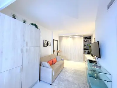 a living room with a couch and a television at Marema appartement, by Welcome to Cannes in Cannes