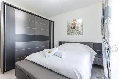 a bedroom with a bed with two towels on it at CANNES: Appartement Cosy à 2 pas de la Croisette in Cannes