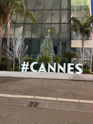 a christmas tree in front of a building at CANNES: Appartement Cosy à 2 pas de la Croisette in Cannes