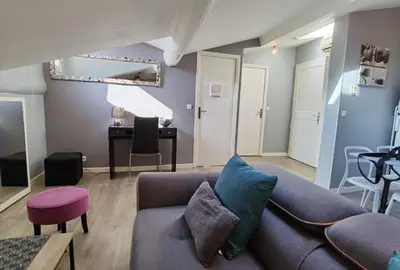 a bedroom with a bed with three pictures on the wall at Croisette 1 min palais des festival/ plages /FIF in Cannes
