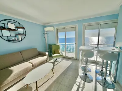 a living room with a couch and a table at Louise appartement, by Welcome to Cannes in Cannes