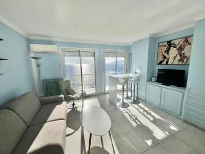 a living room with a couch and a table at Louise appartement, by Welcome to Cannes in Cannes