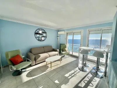 a living room with a couch and a table at Louise appartement, by Welcome to Cannes in Cannes
