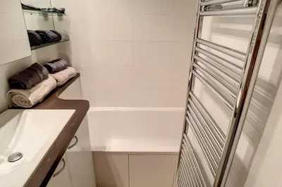 a bathroom with a sink and a shower at HENRI CAMILLE REAL ESTATE - Rouaze 2 -Studio à 50m center in Cannes