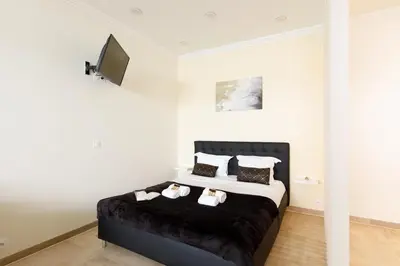 a bedroom with a bed with two towels on it at Gray d'Albion 1D2 YourHostHelper in Cannes