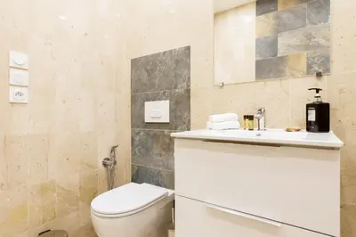 a bathroom with a toilet and a sink at Gray d'Albion 1D2 YourHostHelper in Cannes