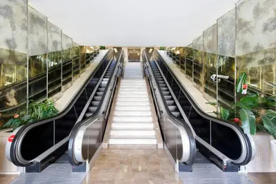 an escalator in a building with escalators at Gray d'Albion 1D2 YourHostHelper in Cannes