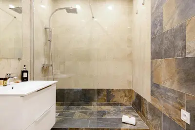 a bathroom with a sink and a shower at Gray d'Albion 1D2 YourHostHelper in Cannes