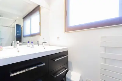a bathroom with a sink and a mirror at Ideal congress and vacation LIVE IN VILLA PARADOR in Cannes