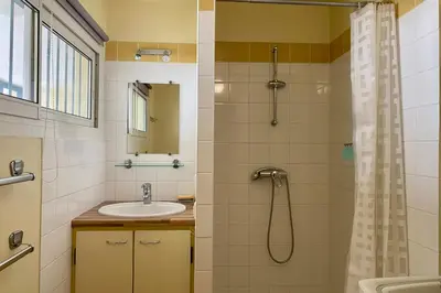 a bathroom with a sink and a shower at Cannes Palm Beach Top Floor Terrace ! SAINT JAMES in Cannes