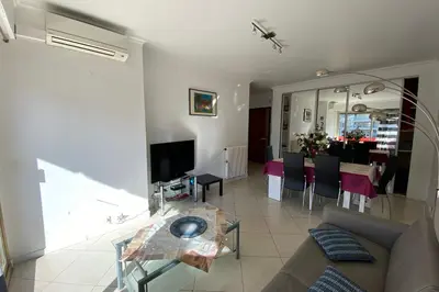 a living room with a couch and a table at 2 rooms facing south 300m from the Croisette LIVE IN LE BOSQUET in Cannes