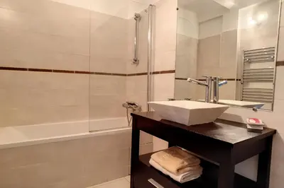 a bathroom with a sink and a shower at HENRI CAMILLE REAL ESTATE - Rouaze - Studio 50m Croisette in Cannes
