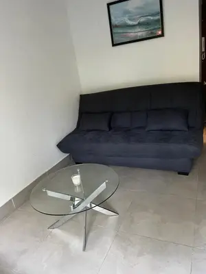 a living room with a glass table and a couch at Residence Eden park in Cannes