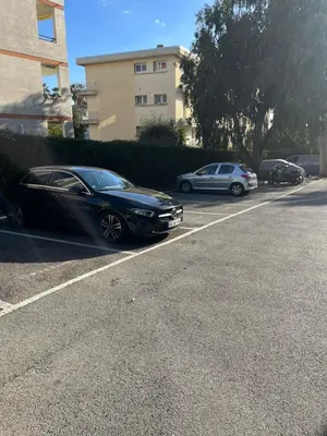 a black car parked on the side of a street at Residence Eden park in Cannes