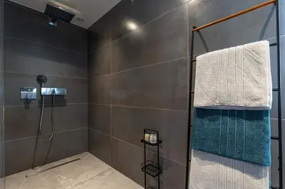 a bathroom with a shower with a glass door at LUXURIOUS PENTHOUSE ROOFTOP MARTINEZ CROISETTE in Cannes