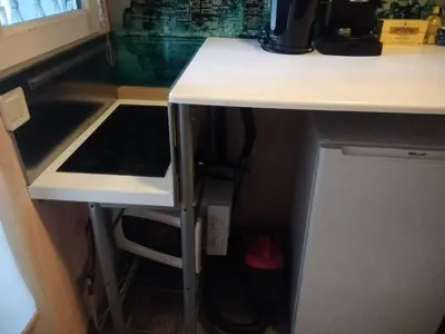 a kitchen with a counter and a sink and a stove at Studette Cannes centre in Cannes