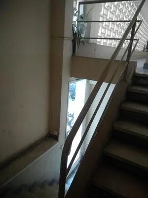 a stairway in a building with a glass door at Studette Cannes centre in Cannes