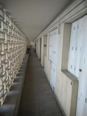 an empty hallway with white doors and a hallwayngth at Studette Cannes centre in Cannes