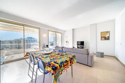 a table in a kitchen with a sign that says pain beach wf private parking at Palm beach- Free Wifi- Parking- Sea View in Cannes