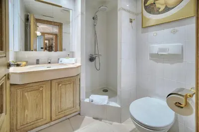 a bathroom with a toilet and a sink and a shower at IMMOGROOM - 2 BR - Air conditioning - Wifi - Terrace - Common parking in Cannes