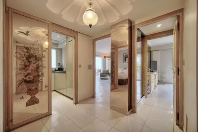 a hallway with sliding glass doors in a home at IMMOGROOM - 2 BR - Air conditioning - Wifi - Terrace - Common parking in Cannes