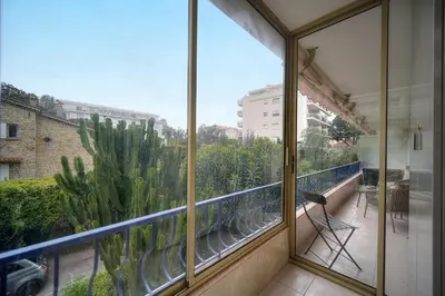 a balcony with a view of a city at IMMOGROOM - 2 BR - Air conditioning - Wifi - Terrace - Common parking in Cannes