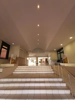 an empty lobby with stairs in a building at Appartement en bord de mer in Cannes